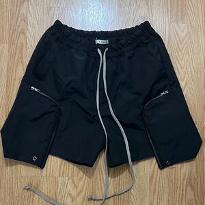 MNML Black  Shorts with Oversized Zippered Pockets.